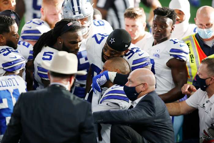Cowboys quarterback Dak Prescott is comforted by his teammates after an injury in the third quarter against the New York Giants.